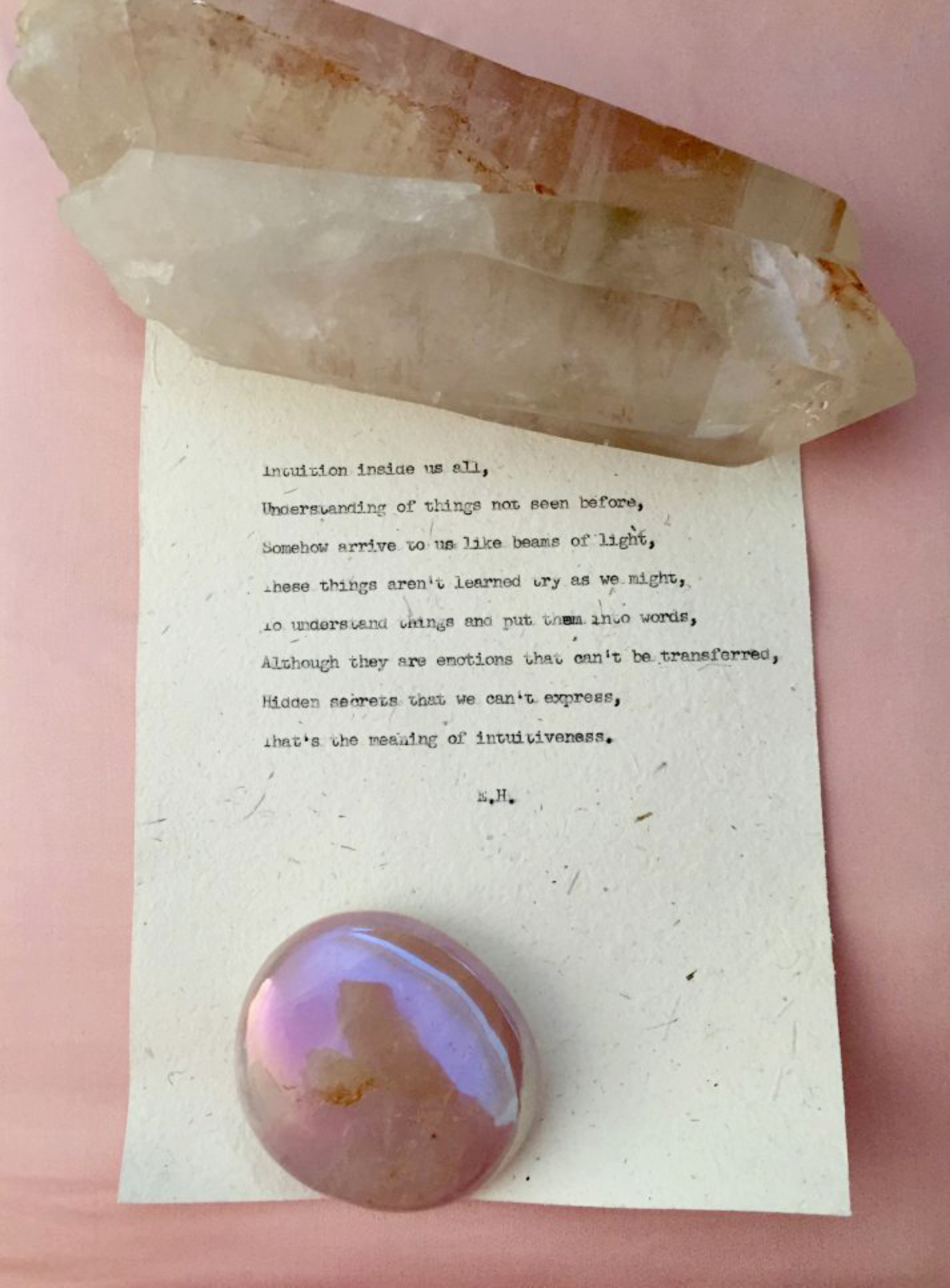 image of typewritten poem by Evered Higgins, held with crystals